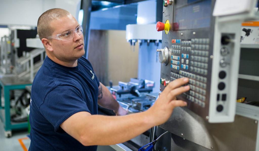 Man in front of panel